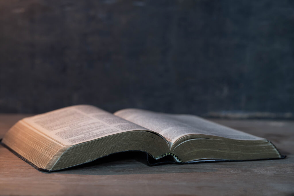 Bible on wooden background